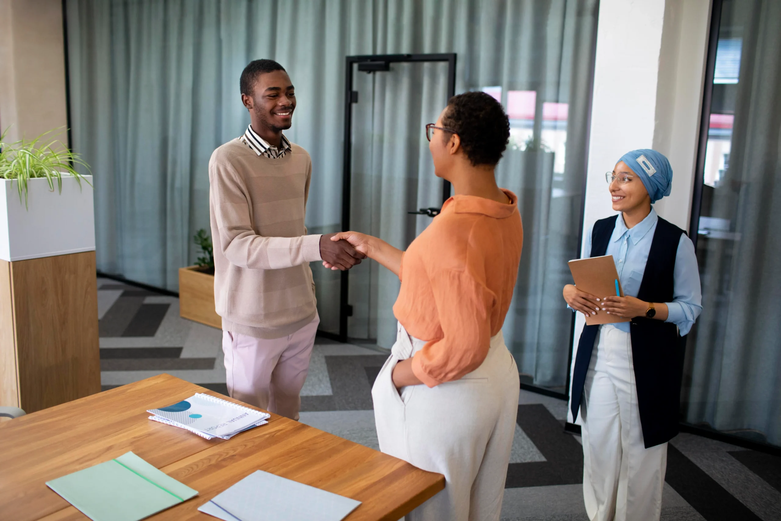 man-introducing-himself-employers-office-job-interview